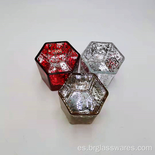 Portavelas de cristal en forma hexagonal con diferentes colores